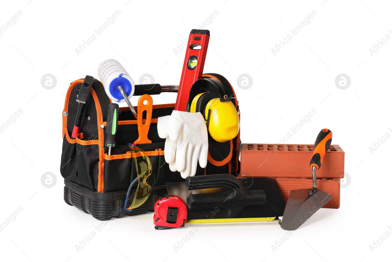 Photo of Bag with construction tools and building materials isolated on white