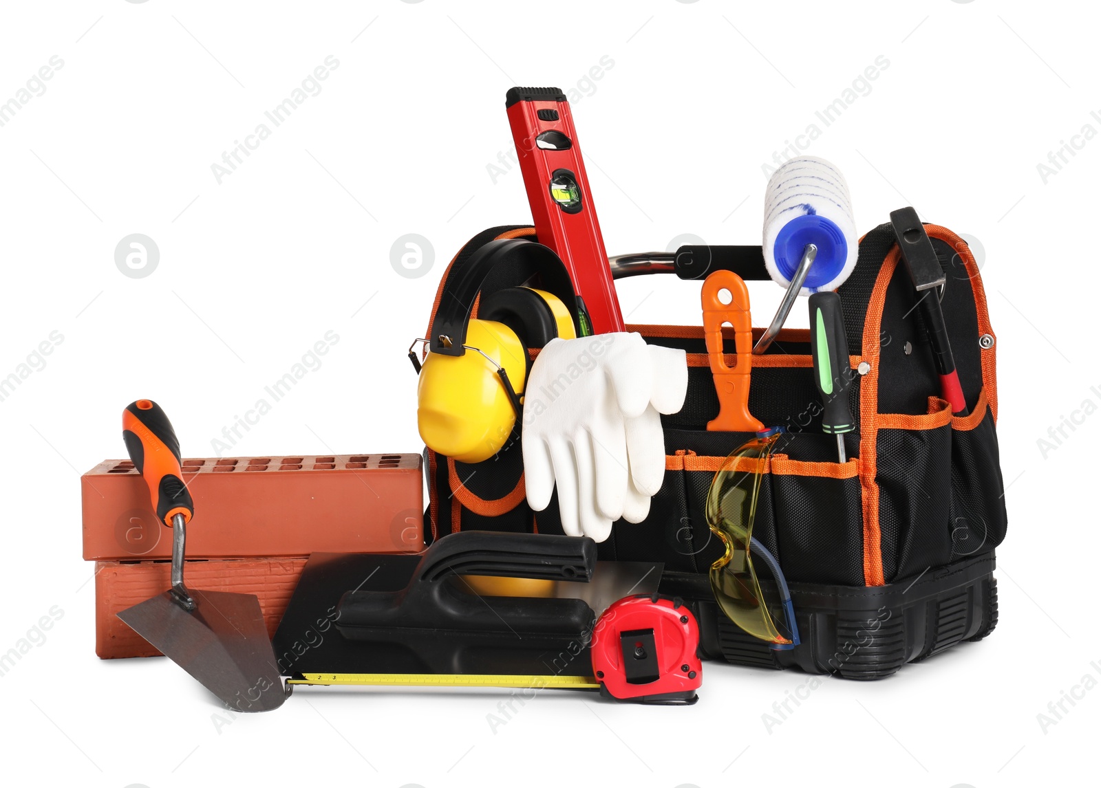 Photo of Bag with construction tools and building materials isolated on white