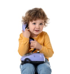 Photo of Cute little boy with telephone on stool against white background