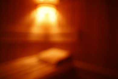 Photo of Blurred view of empty traditional wooden sauna