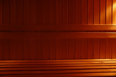 Photo of View of empty wooden sauna with bench