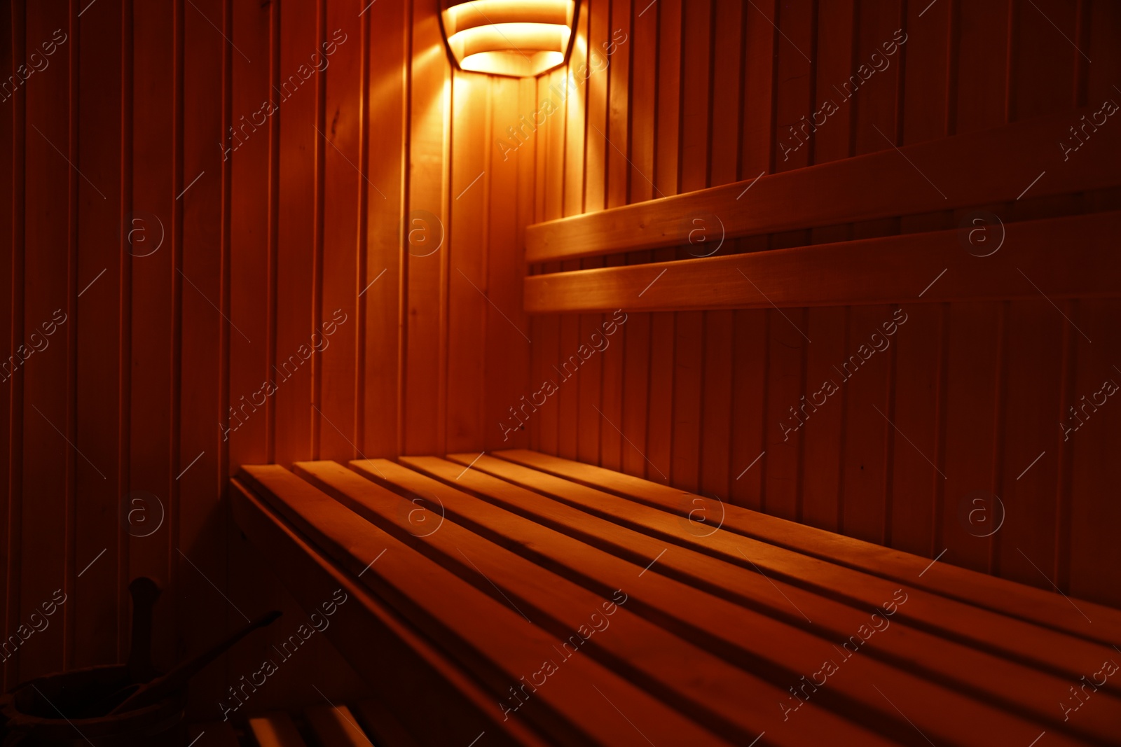 Photo of View of empty wooden sauna with bench