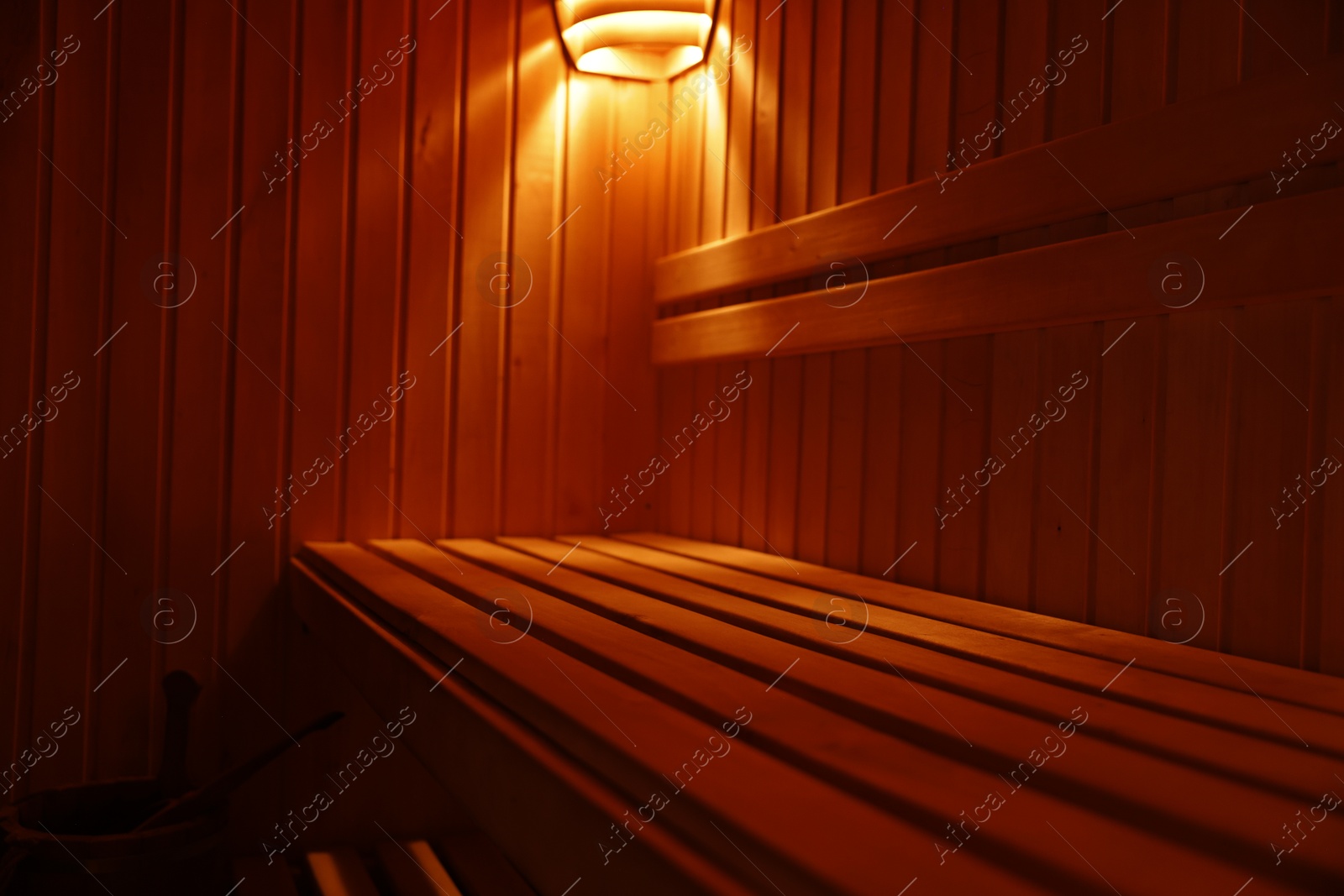 Photo of View of empty wooden sauna with bench