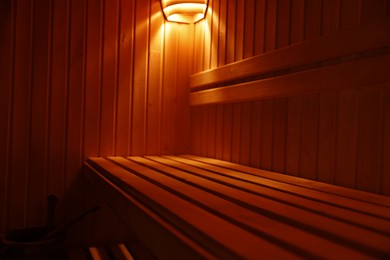 Photo of View of empty wooden sauna with bench