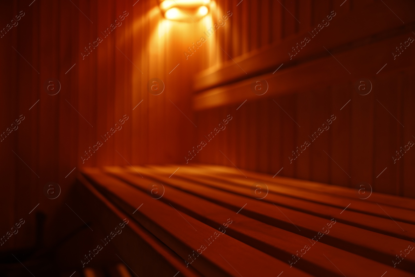 Photo of View of empty wooden sauna with bench