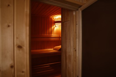 Photo of View of empty wooden sauna with bench