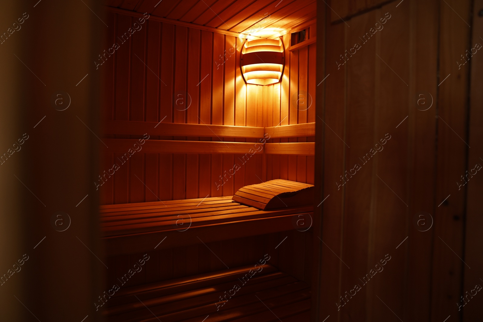 Photo of View of empty wooden sauna with bench