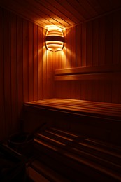 Photo of View of empty wooden sauna with bench