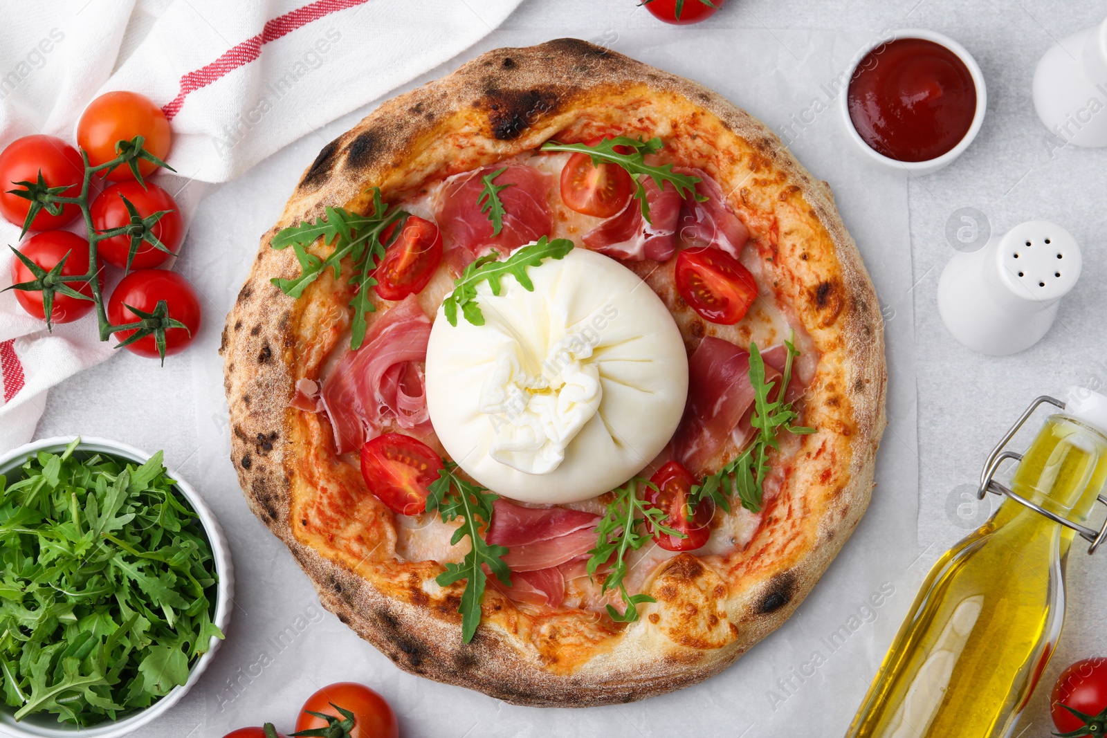 Photo of Delicious pizza with burrata cheese served on light grey table, top view