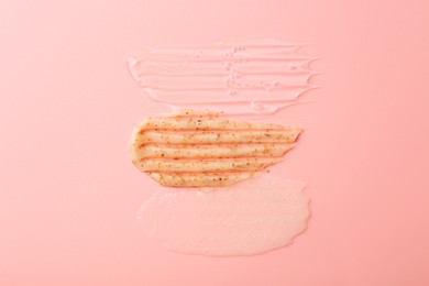 Photo of Samples of cosmetic products on pink background, top view. Skin care