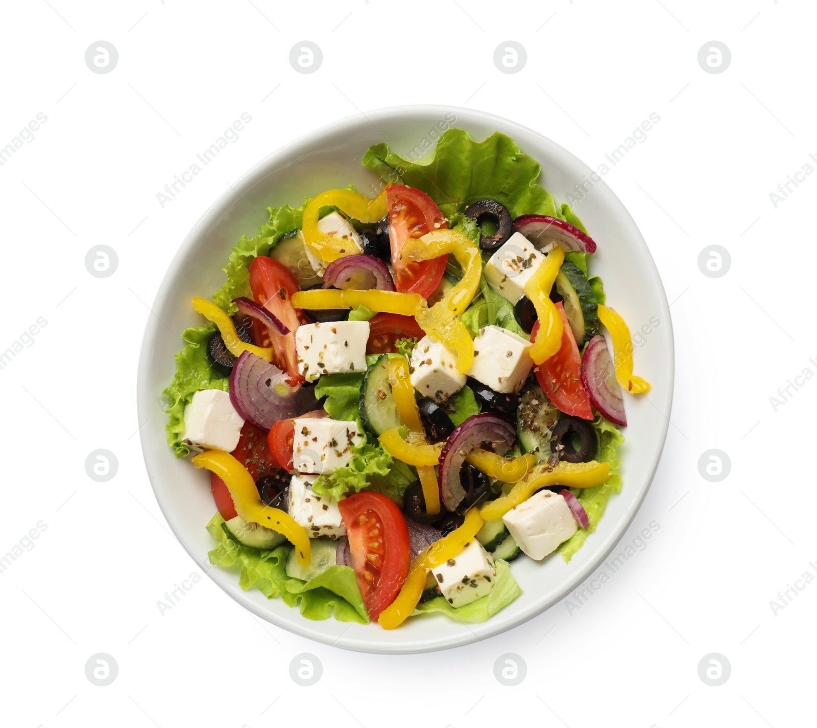 Photo of Delicious fresh Greek salad in bowl on white background, top view