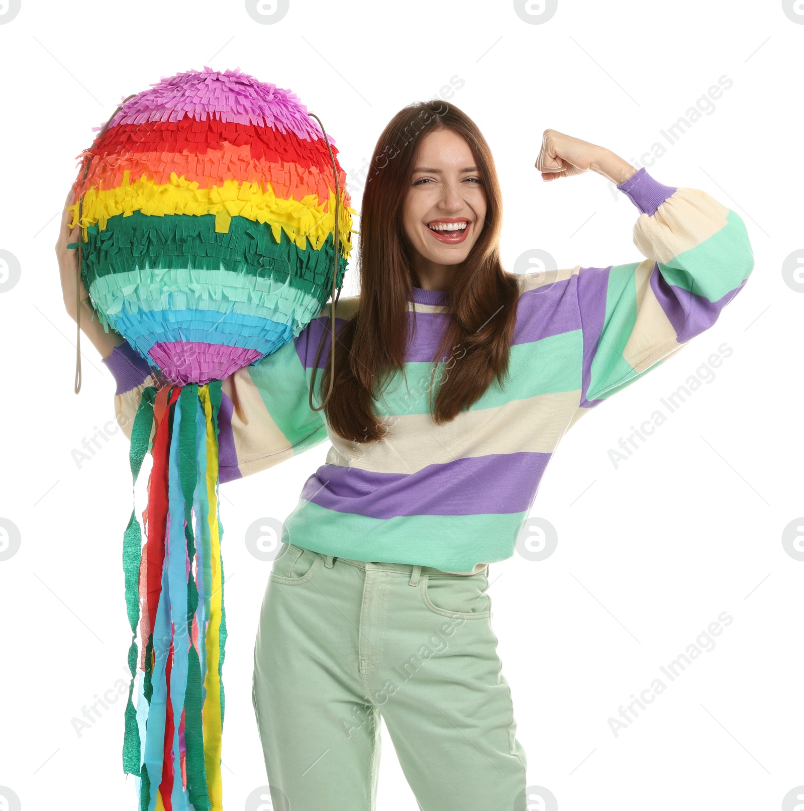 Photo of Happy woman with colorful pinata showing her strength isolated on white