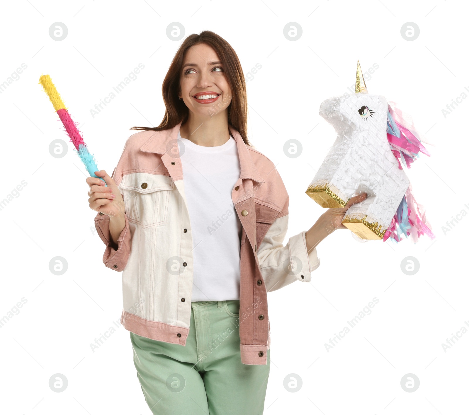 Photo of Happy woman with unicorn shaped pinata and stick isolated on white