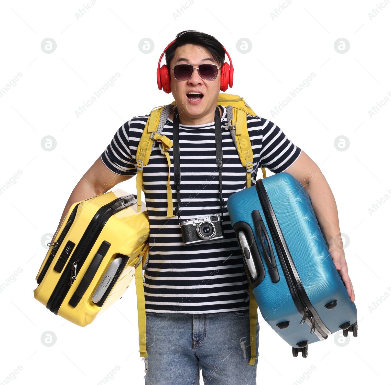 Photo of Traveller carrying heavy suitcases on white background