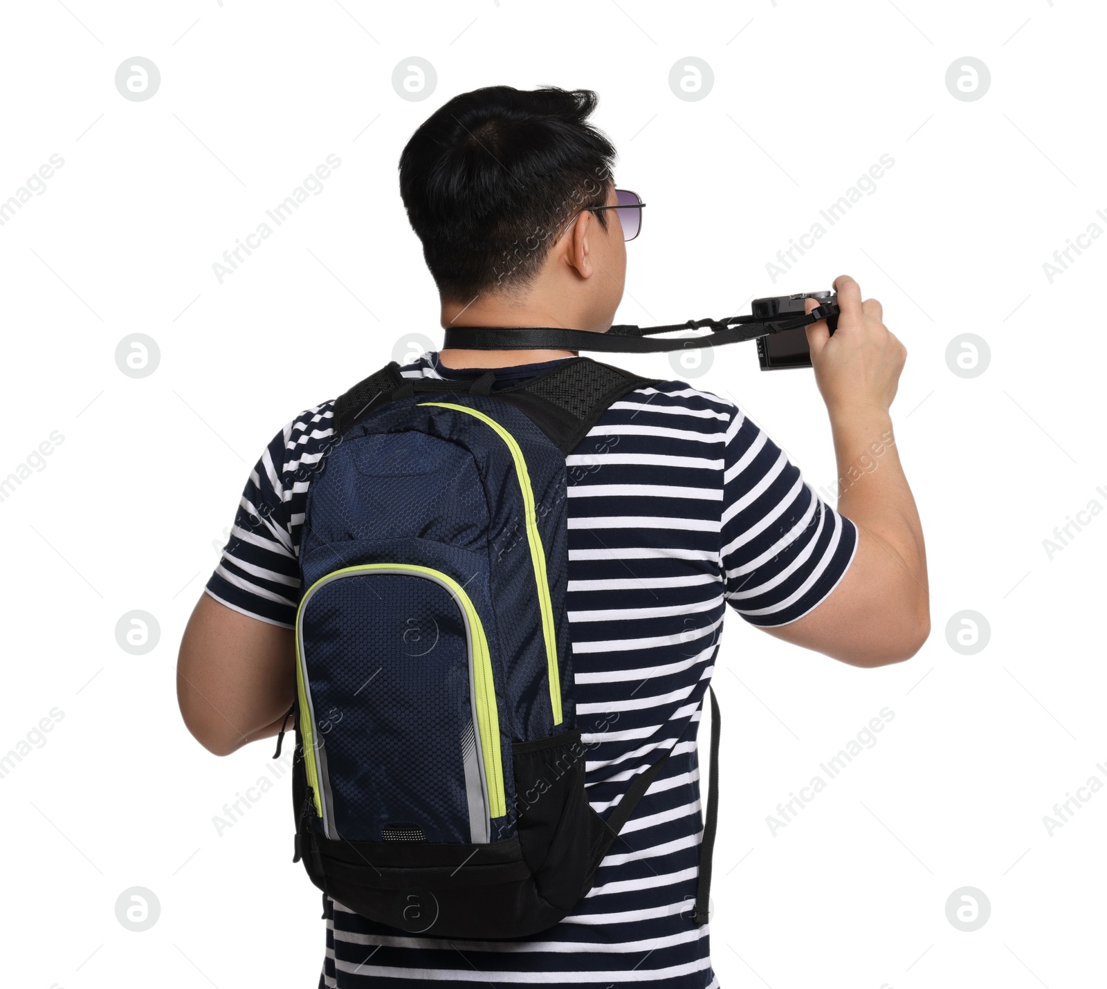 Photo of Traveller with backpack taking photo on white background, back view