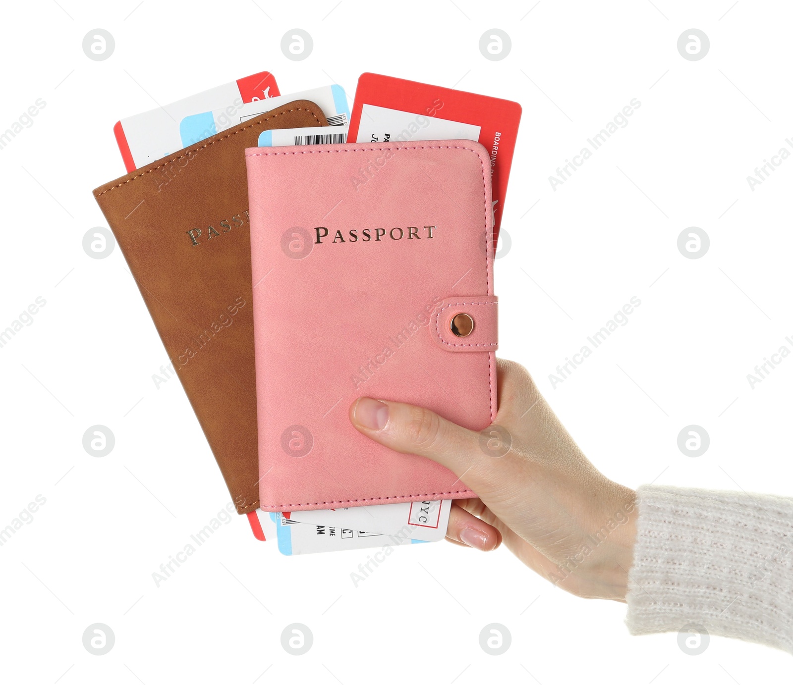 Photo of Woman holding passports with tickets on white background, closeup