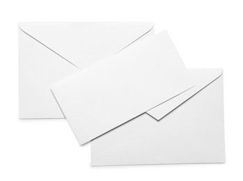 Photo of Envelopes with card isolated on white, top view. Mockup for design