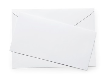 Photo of Envelope with card isolated on white, top view. Mockup for design