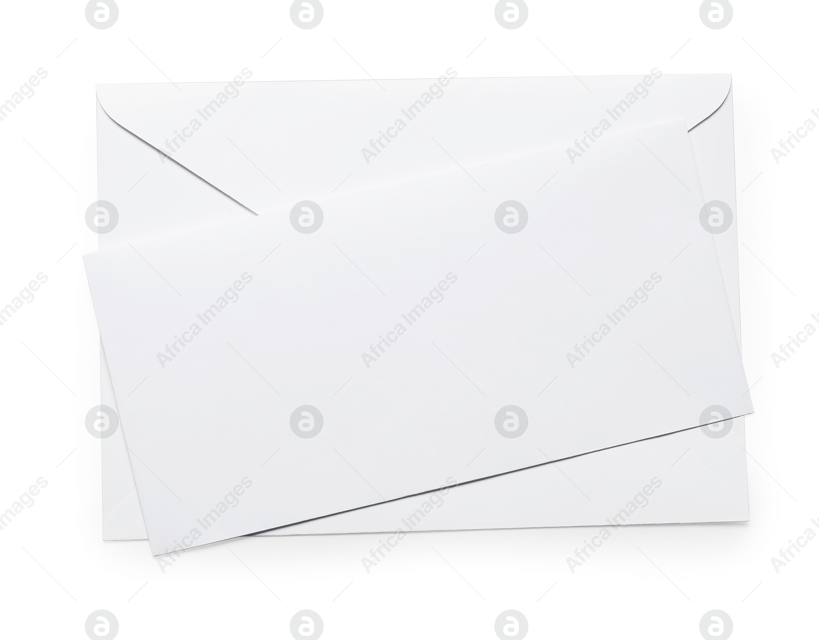 Photo of Envelope with card isolated on white, top view. Mockup for design