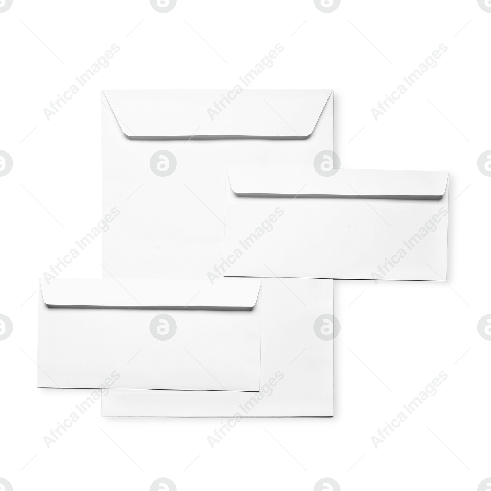 Photo of Envelopes isolated on white, top view. Mockup for design