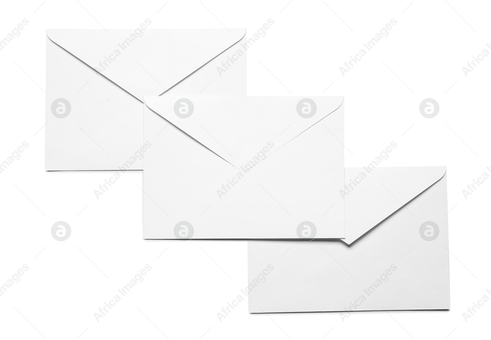 Photo of Envelopes isolated on white, top view. Mockup for design