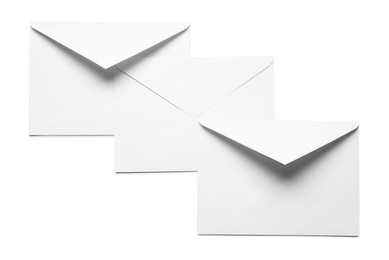 Photo of Envelopes isolated on white, top view. Mockup for design