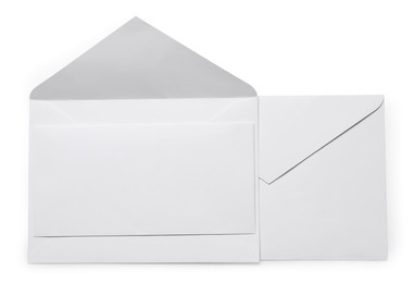 Photo of Envelopes with card isolated on white, top view. Mockup for design