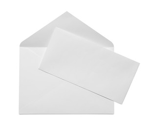 Photo of Envelope with card isolated on white, top view. Mockup for design