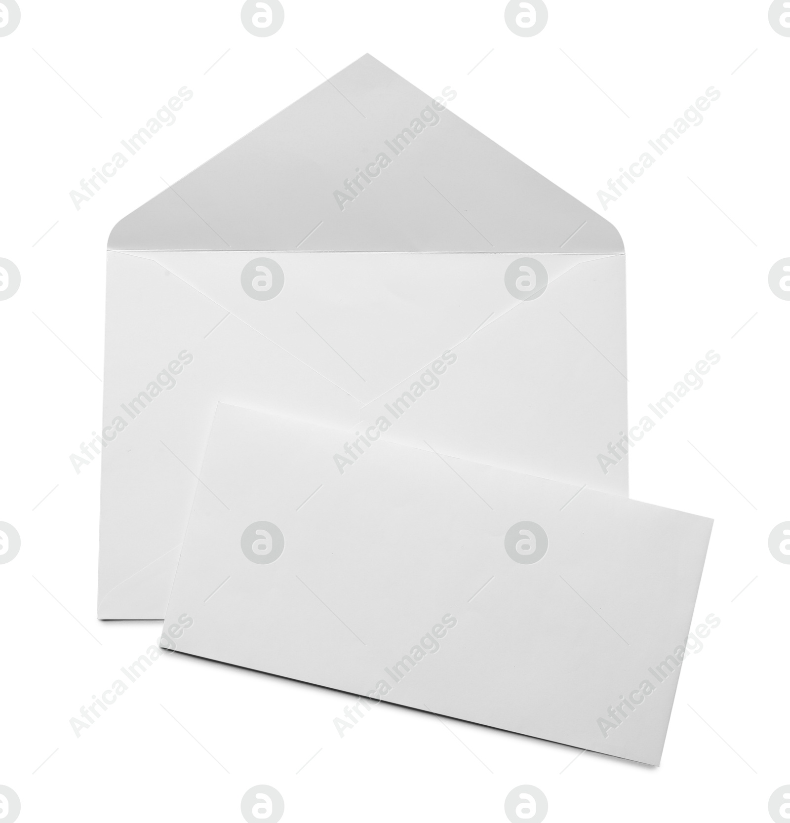 Photo of Envelope with card isolated on white, top view. Mockup for design