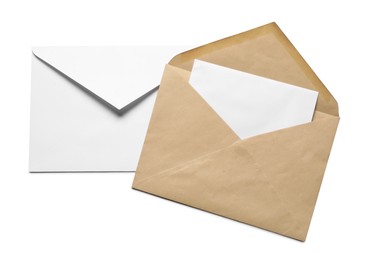 Photo of Envelopes with card isolated on white, top view. Mockup for design