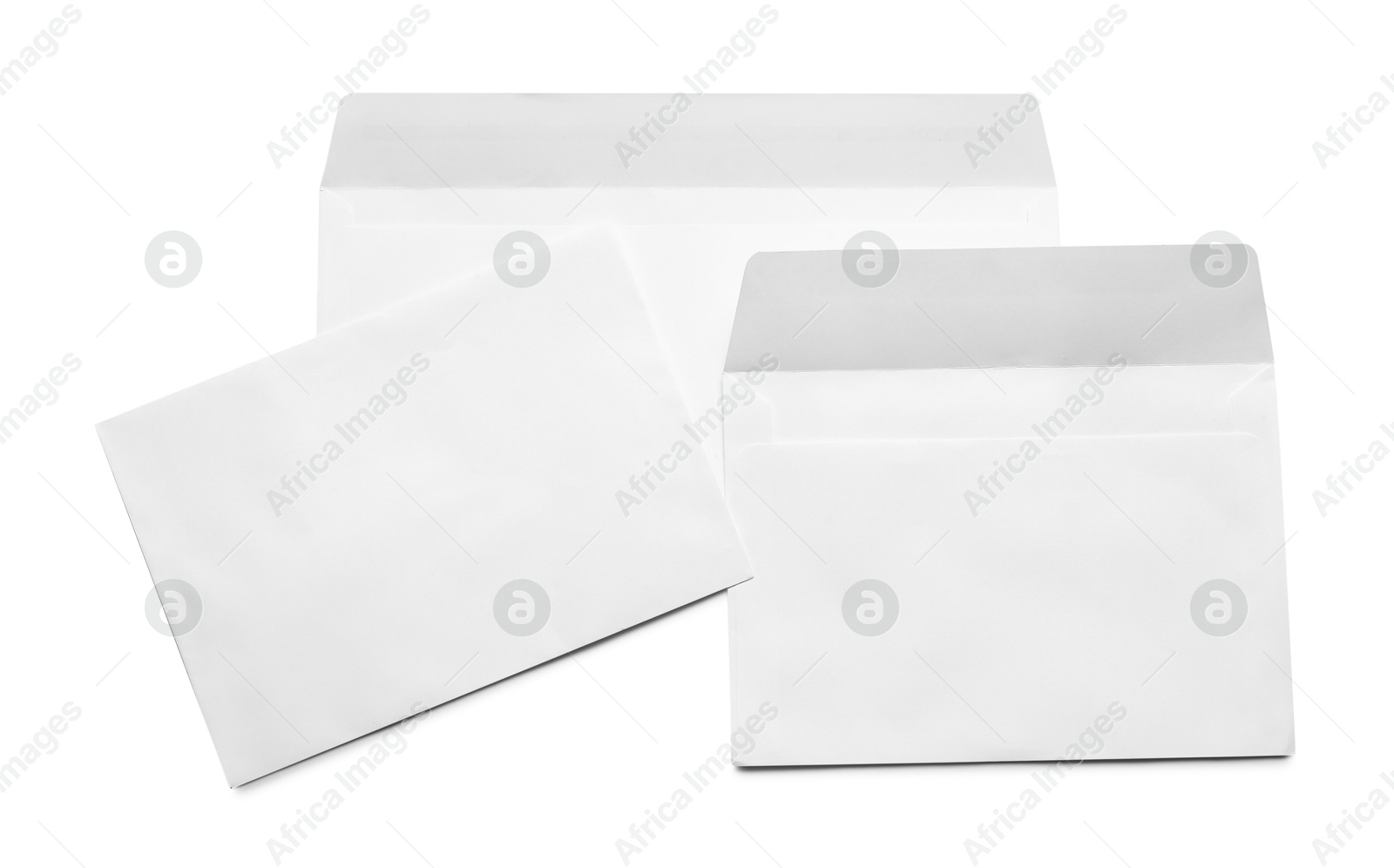 Photo of Envelopes isolated on white, top view. Mockup for design