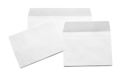 Photo of Envelopes isolated on white, top view. Mockup for design