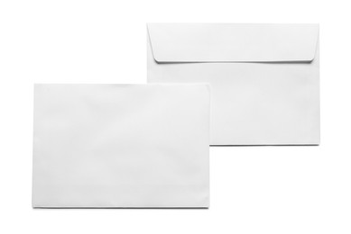 Photo of Envelopes isolated on white, top view. Mockup for design