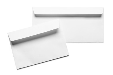 Photo of Envelopes isolated on white, top view. Mockup for design