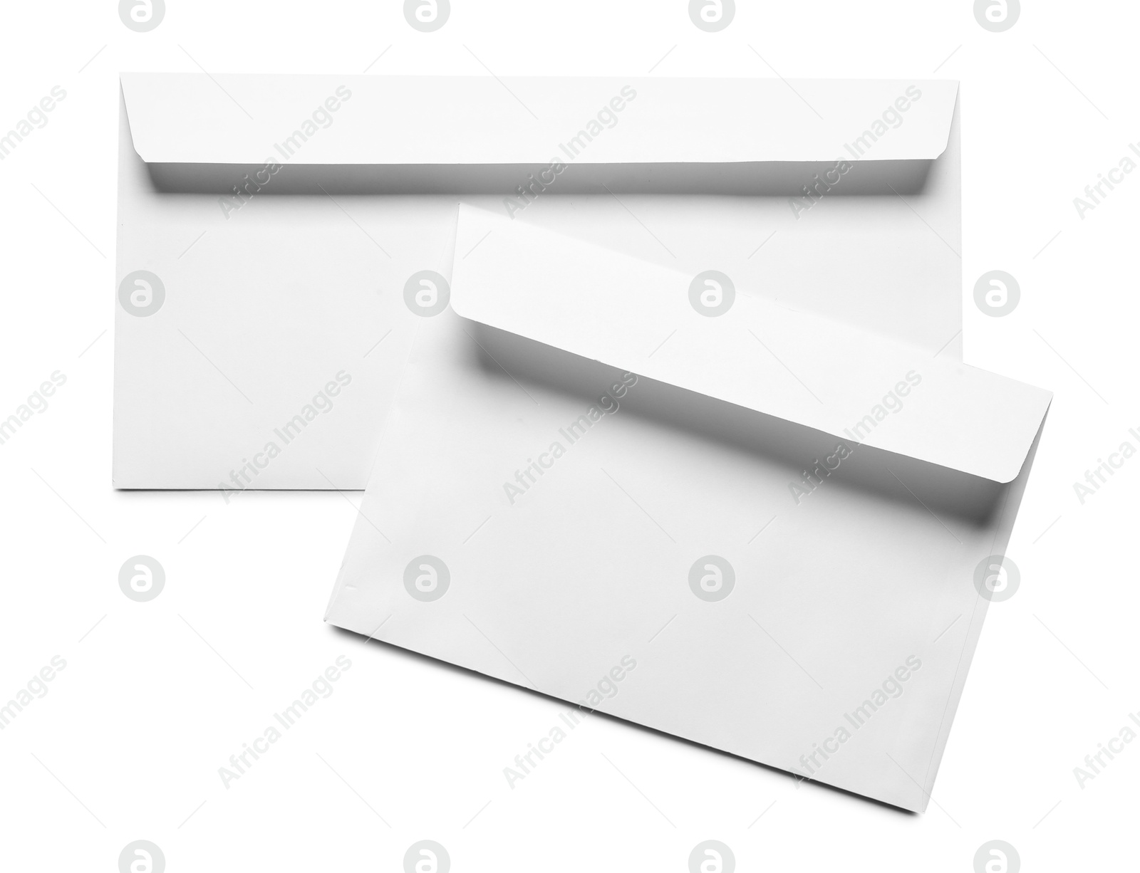 Photo of Envelopes isolated on white, top view. Mockup for design