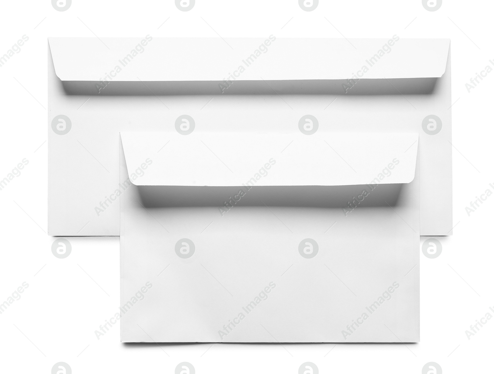 Photo of Envelopes isolated on white, top view. Mockup for design