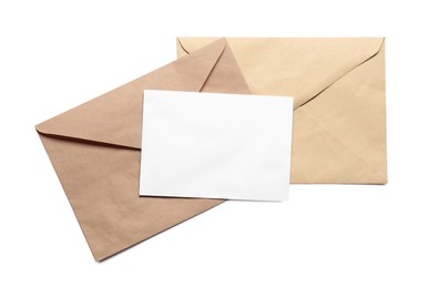 Photo of Envelopes isolated with card on white, top view. Mockup for design