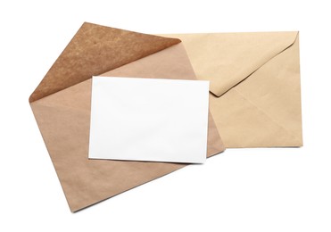 Photo of Envelopes isolated with card on white, top view. Mockup for design