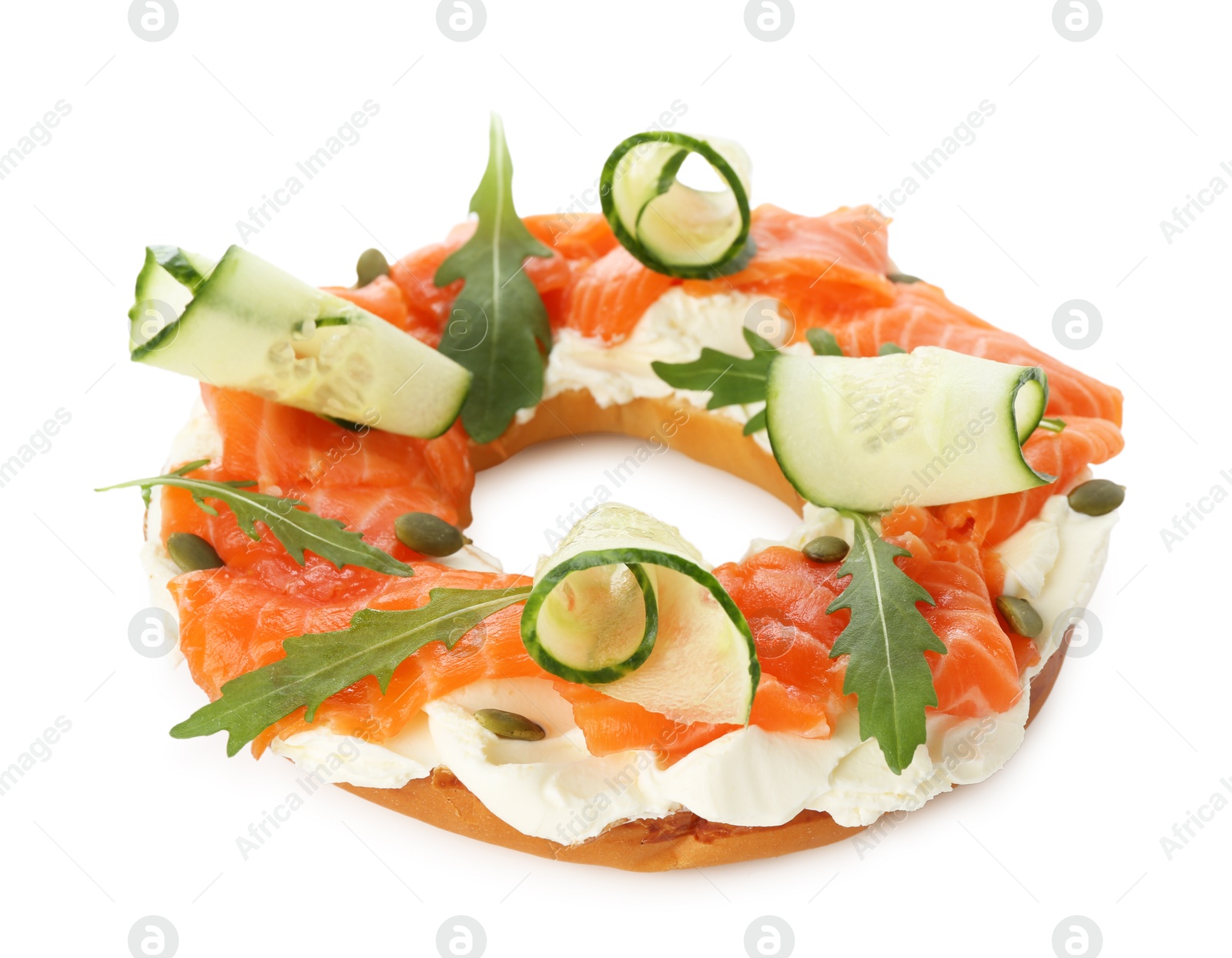 Photo of Half of delicious bagel with salmon, cream cheese and cucumber isolated on white