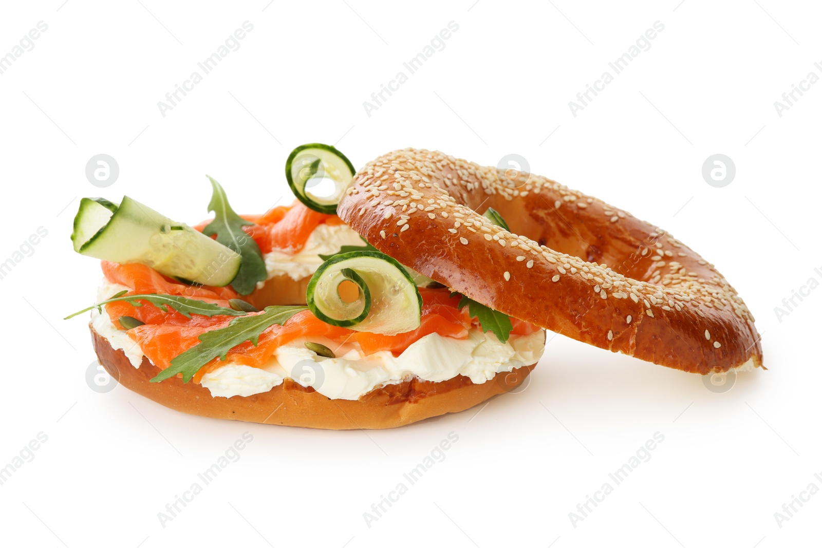 Photo of Delicious bagel with salmon, cream cheese and cucumber isolated on white