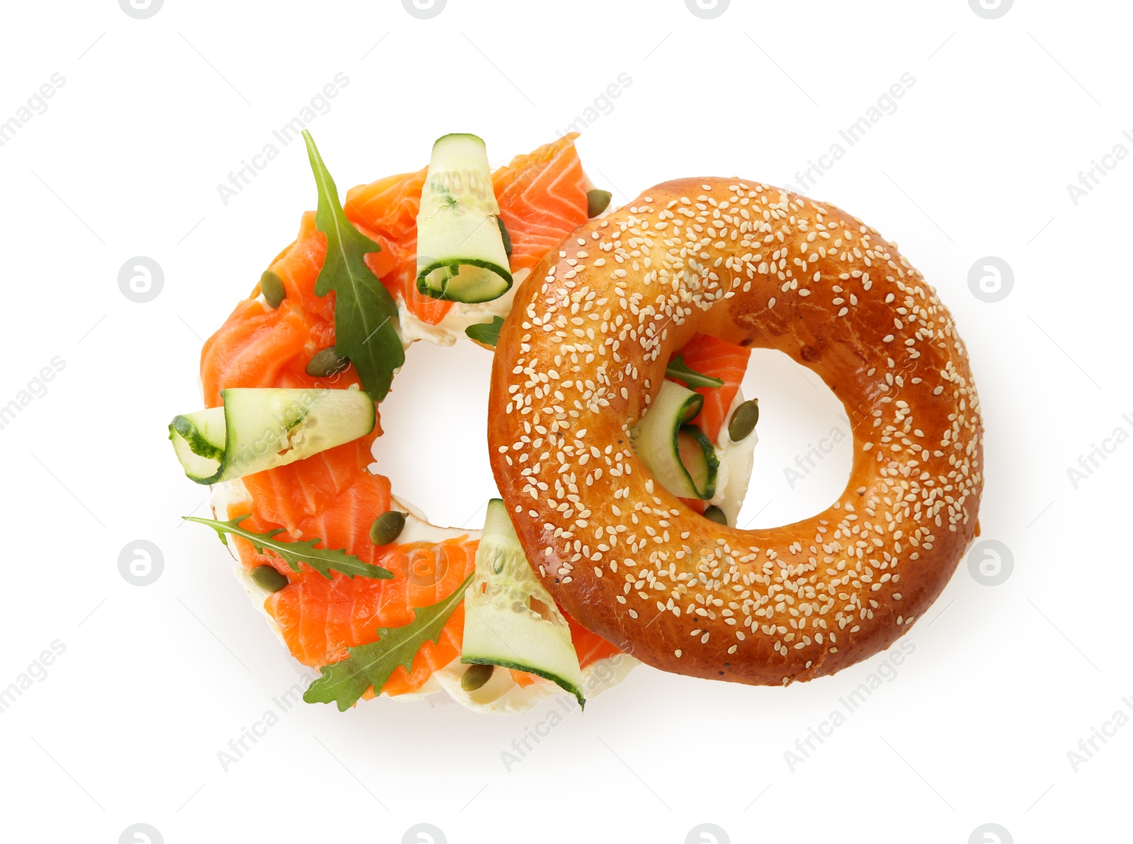 Photo of Delicious bagel with salmon, cream cheese and cucumber isolated on white, top view