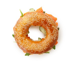 Photo of Delicious bagel with salmon and cucumber isolated on white, top view