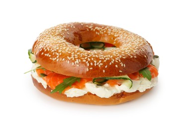 Photo of Delicious bagel with salmon, cream cheese and cucumber isolated on white