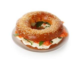 Photo of Delicious bagel with salmon, cream cheese and cucumber isolated on white