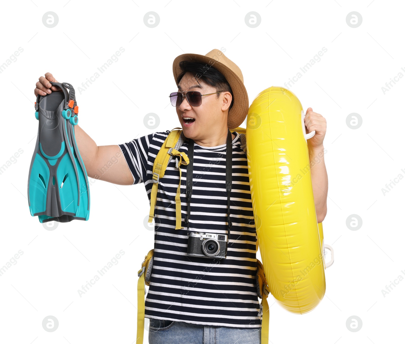 Photo of Traveller with inflatable ring and swim fins on white background