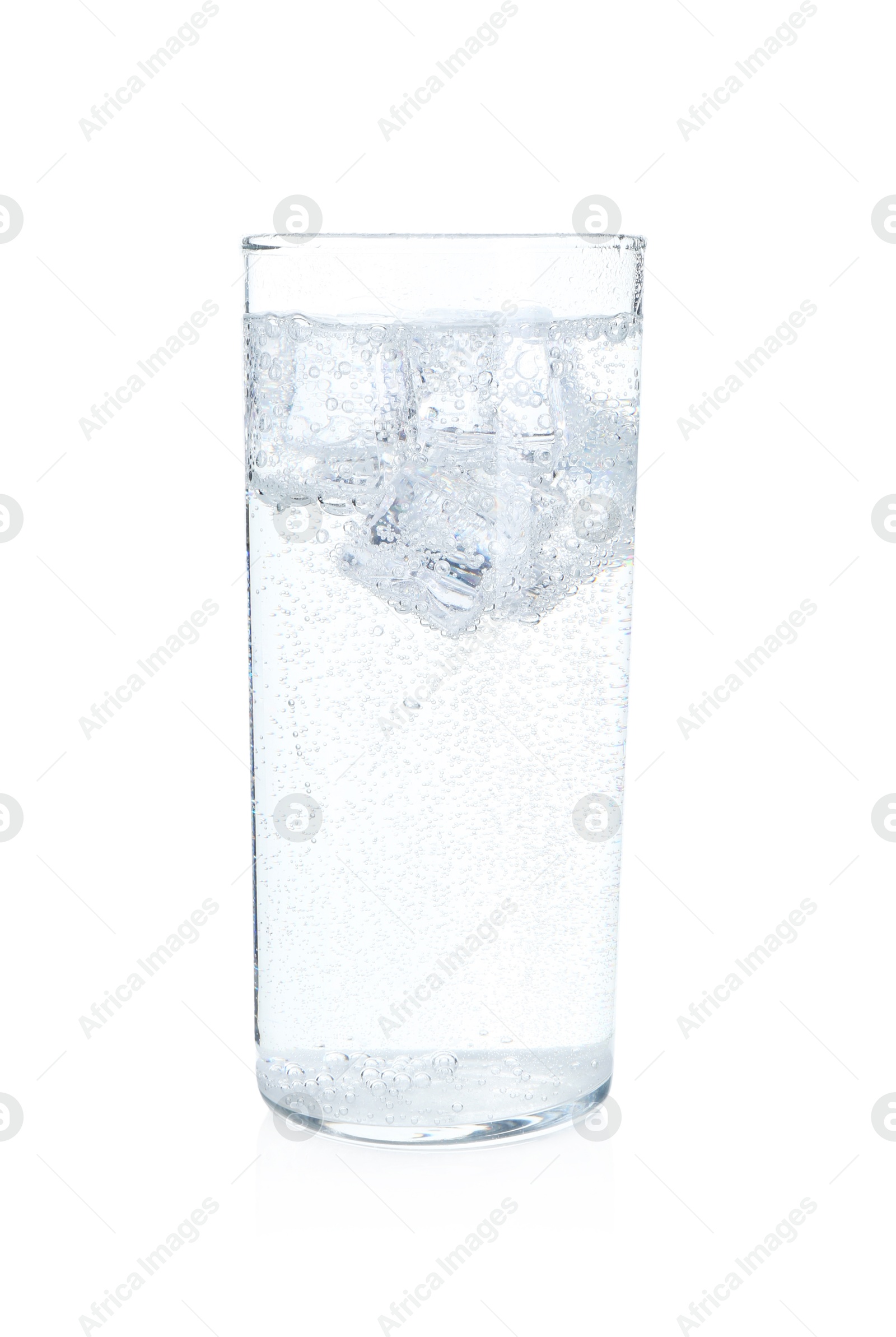 Photo of Glass of refreshing soda water with ice cubes isolated on white