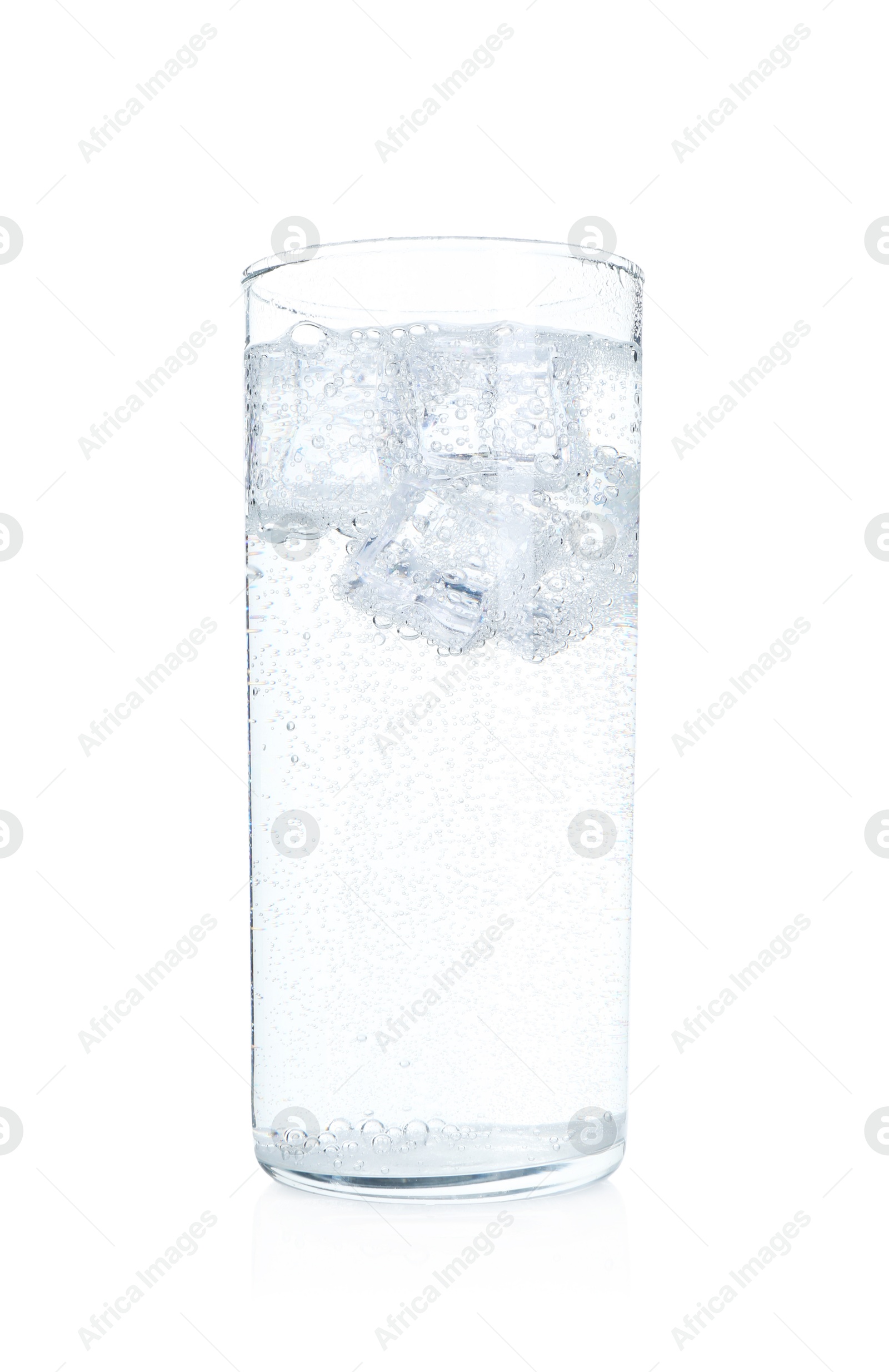 Photo of Glass of refreshing soda water with ice cubes isolated on white