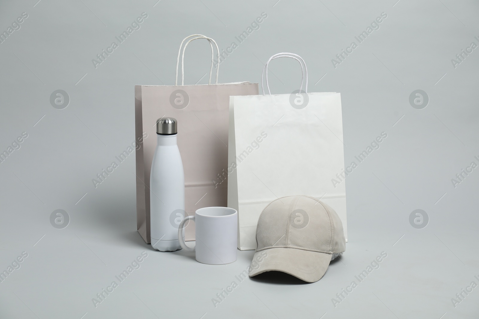 Photo of Different blank items for branding on light grey background. Mockup for design