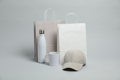 Photo of Different blank items for branding on light grey background. Mockup for design