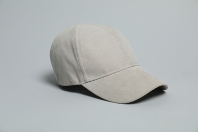 Photo of Blank baseball cap for branding on light grey background. Mockup for design